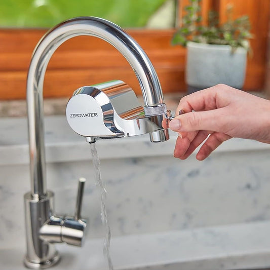 ZeroWater ExtremeLife faucet mount filter attached to kitchen faucet, demonstrating clean, filtered water flow.