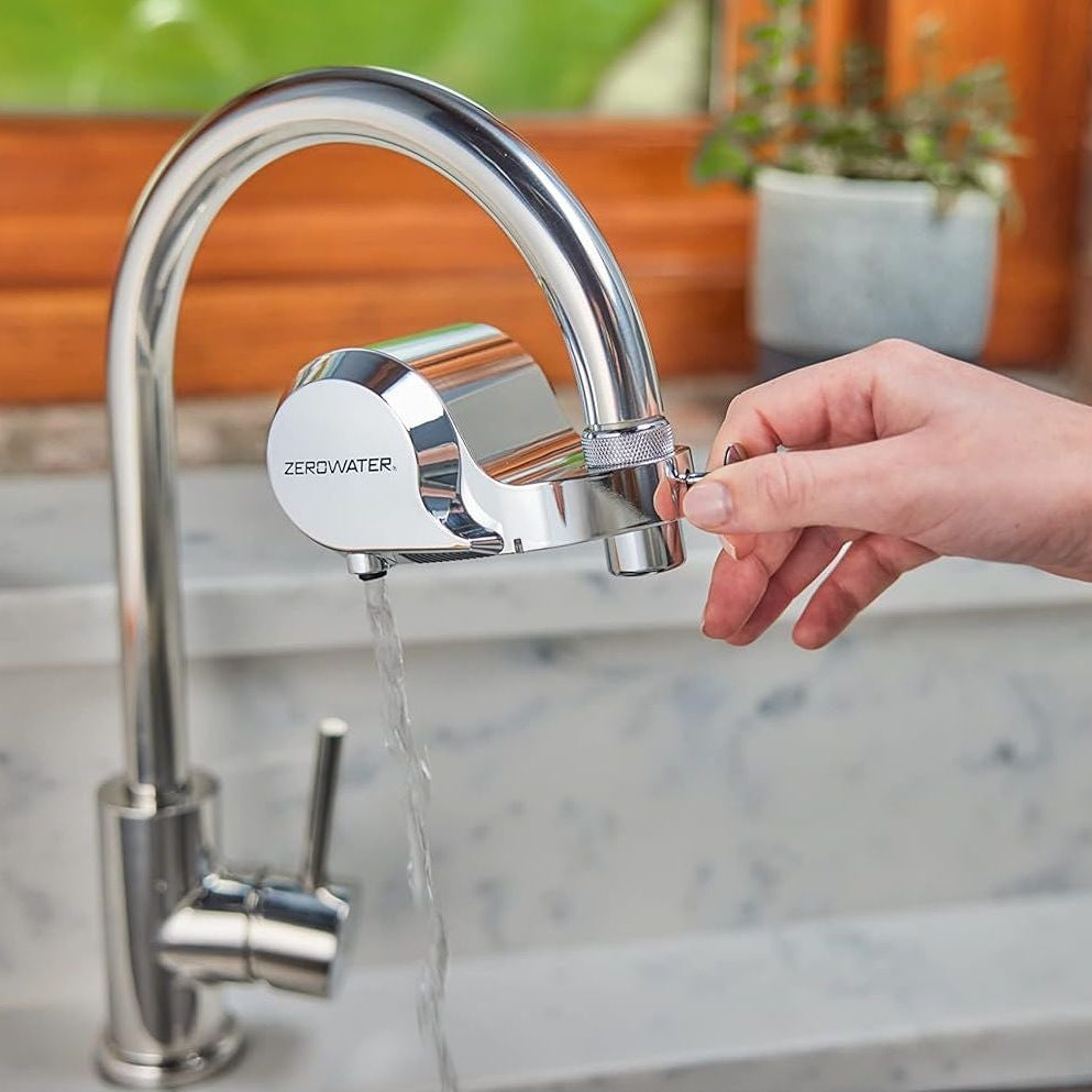 ZeroWater ExtremeLife faucet mount filter attached to kitchen faucet, demonstrating clean, filtered water flow.