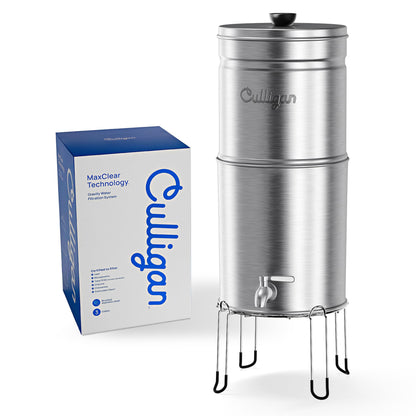 Culligan MaxClear gravity water filter system installed on a kitchen countertop with clear water container and filtration components